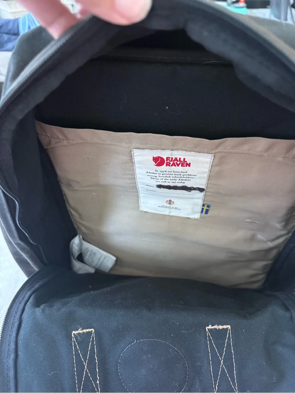 Fjallraven Kanken Canvas Backpack in Black with Brown Leather Accents